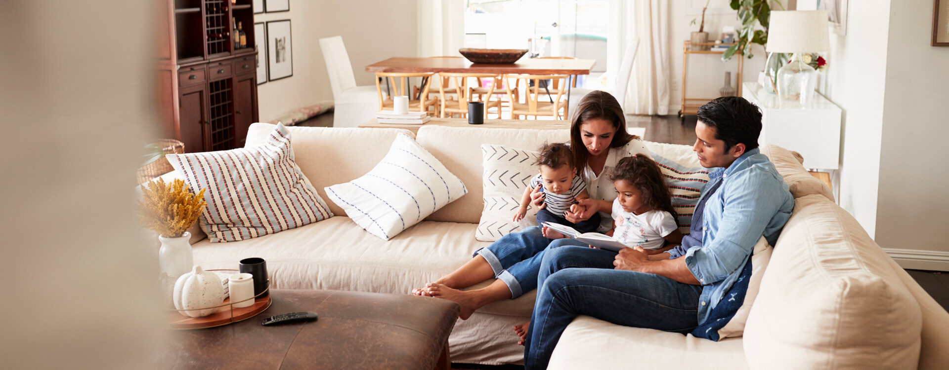 Family sitting on a couch together